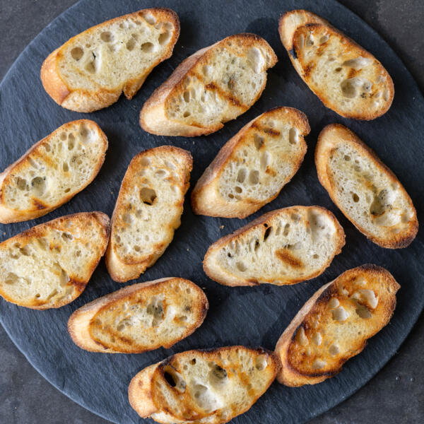Toasted bread on a tray.