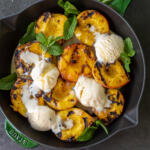 Grilled Peaches with Ice Cream in a tray.