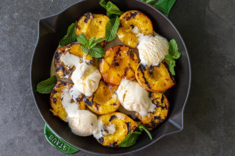Grilled Peaches with Ice Cream in a tray.
