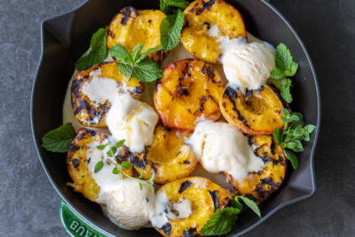 Grilled Peaches with Ice Cream in a tray.