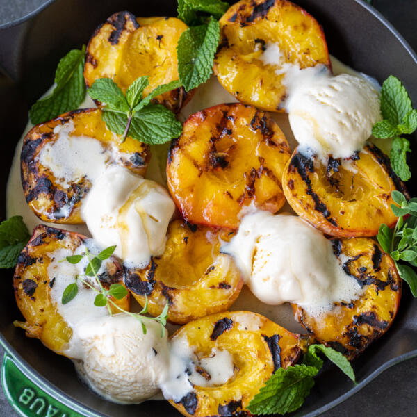 Grilled Peaches with Ice Cream in a tray.