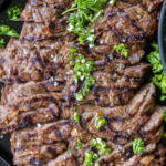 Sliced up Skirt Steak on a tray.