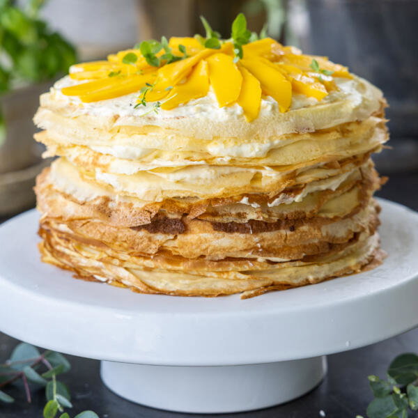 Mango Crepe Cake on a cake stand.