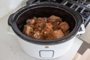 Slow cooker with all the oxtail ingredients.