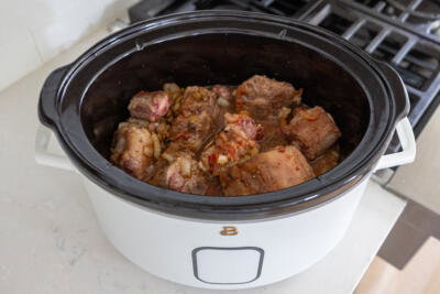Slow cooker with all the oxtail ingredients.