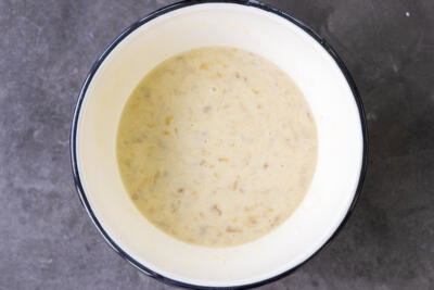 All the wet ingredients for muffin recipe in a bowl.