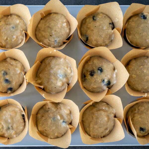 Unbaked muffins in a pan.
