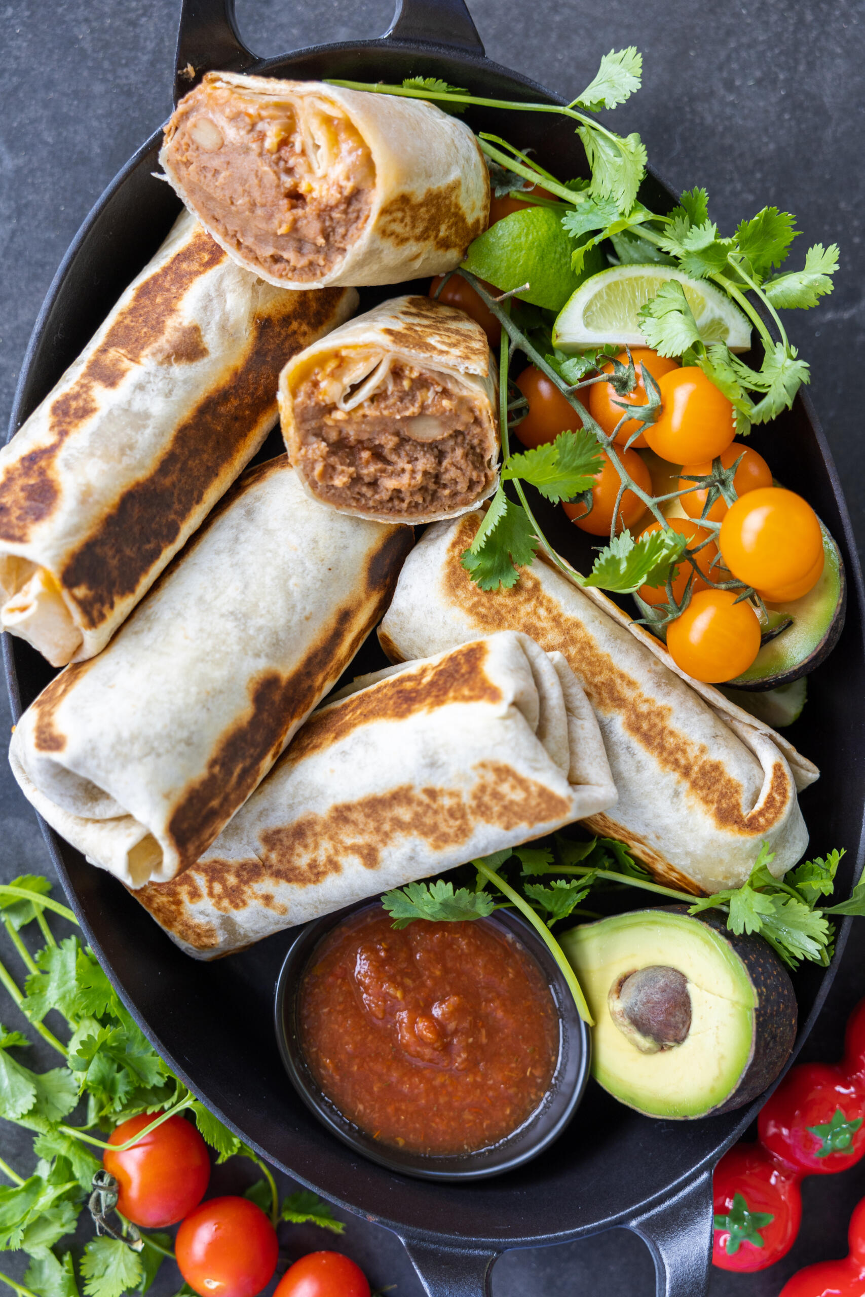 Bean and Cheese Burritos in a serving dish.