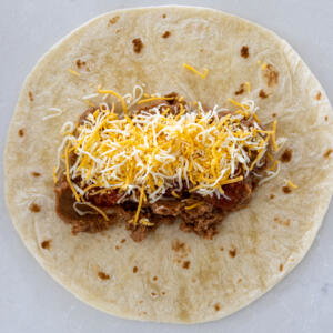 Tortilla with cheese and salsa.