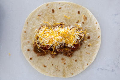 Tortilla with cheese and salsa.