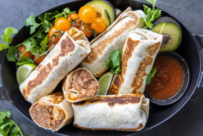 Bean and Cheese Burritos in a serving dish.