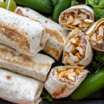 Serving tray with Chicken Burritos.