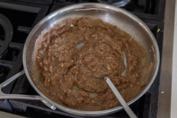 Refried beans in a pan.