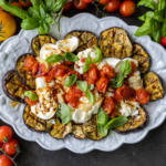 Serving tray with Grilled Eggplant with Burrata & Roasted Tomatoes.