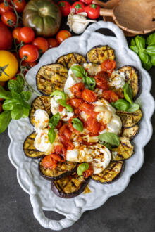 Plated Grilled Eggplant with Burrata & Roasted Tomatoes.