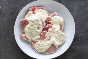 Pork with marinate in a bowl.