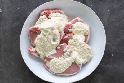 Pork with marinate in a bowl.