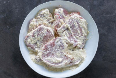 Marinating port in a bowl.