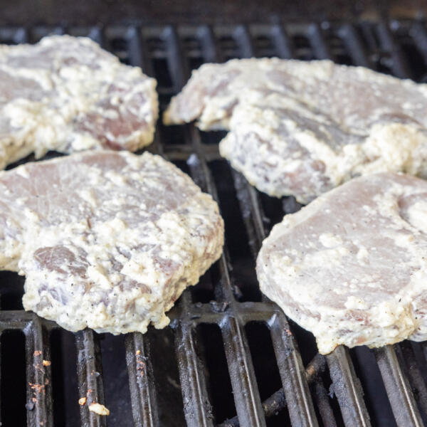 Pork Loin Chops cooking on a grill