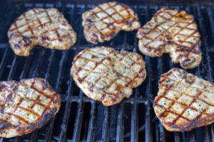 Pork Loin Chops on a grill.