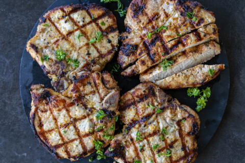 Pork Loin Chops sliced on a serving plate.
