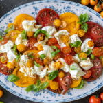 Tomato Burrata Salad on a serving plate.