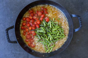 Tomato and asparagus in a pan.