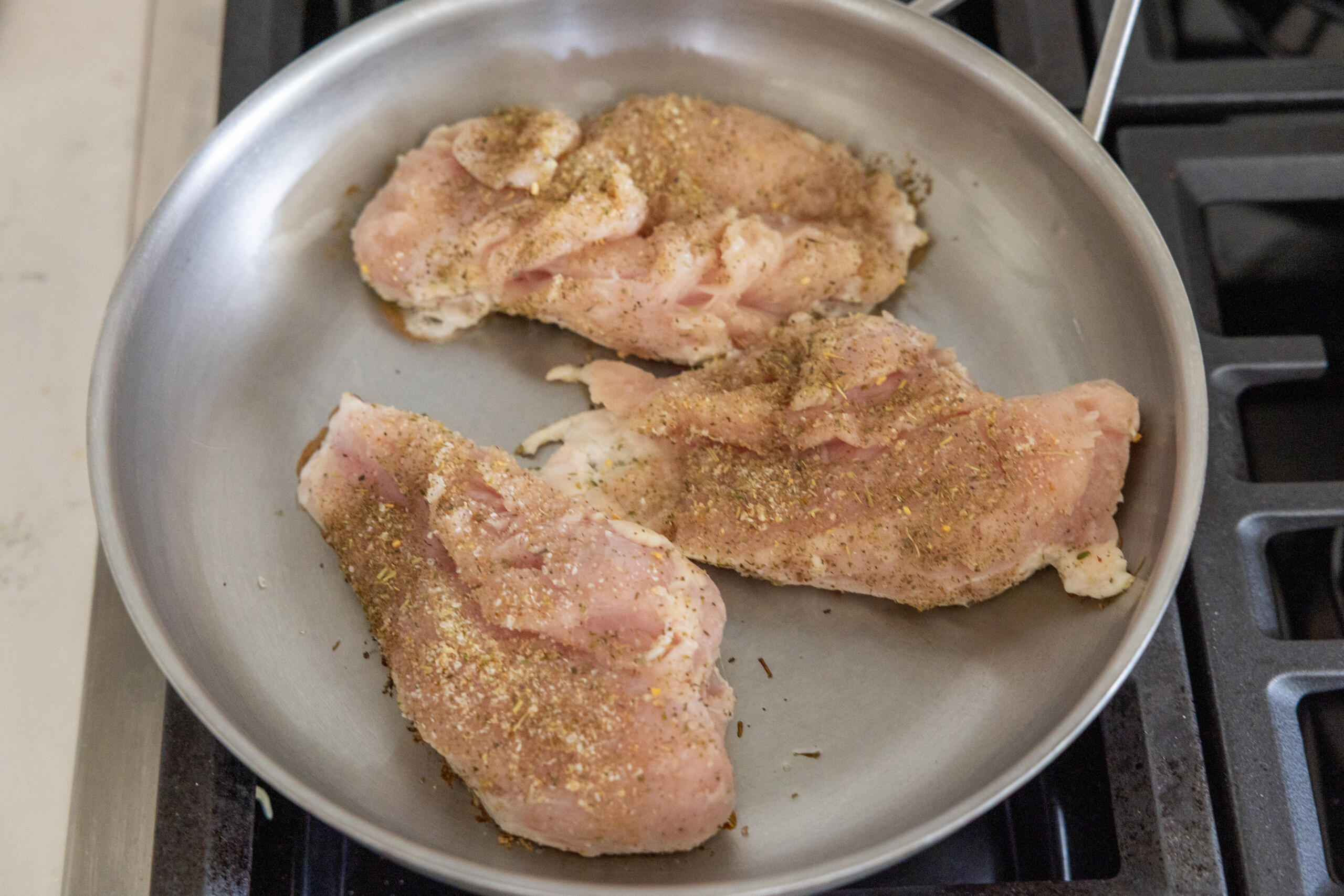 chicken cooking in a pan.
