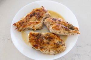 Cooked chicken on a plate.