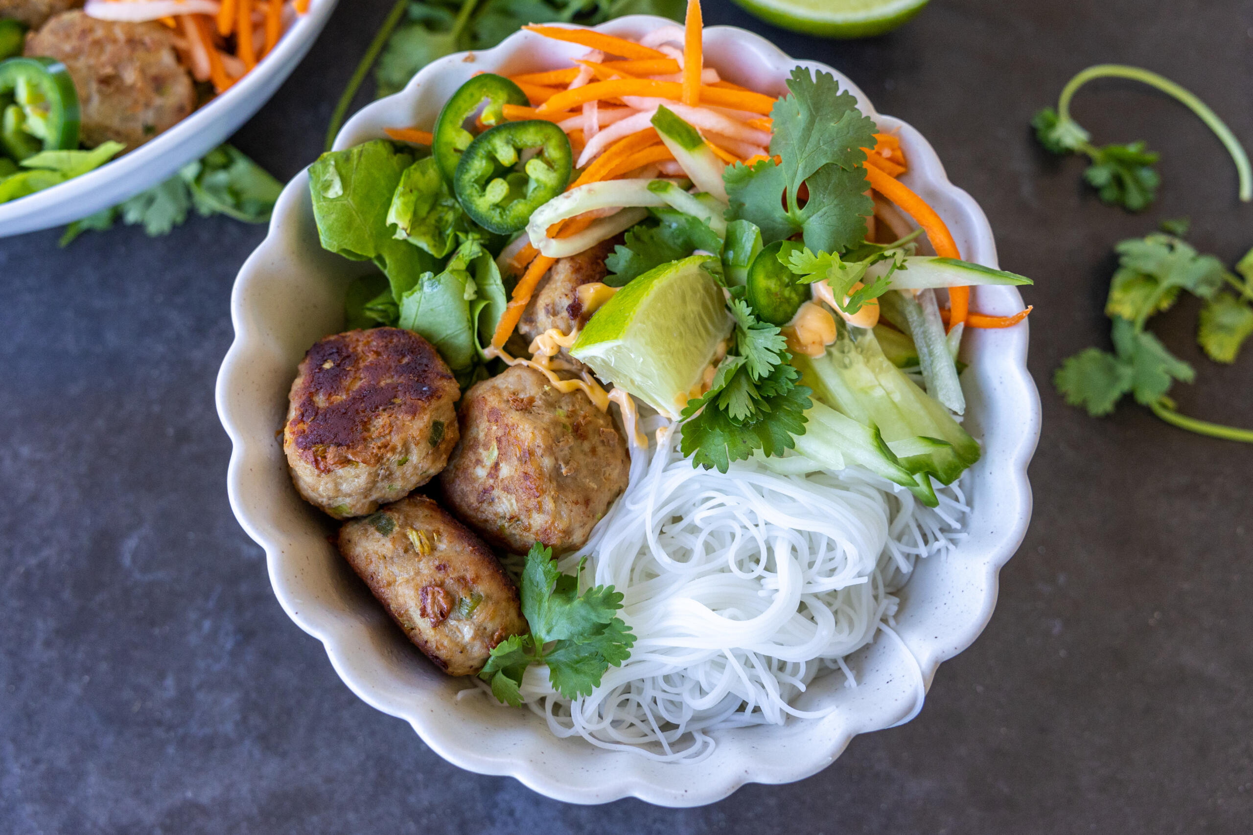 Turkey Meatballs with Vermicelli Bowl with more bowls around.